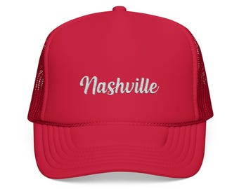 May include: Red trucker hat with a white embroidered "Nashville" logo.