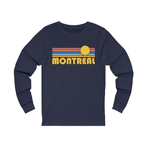 May include: Navy blue long-sleeve t-shirt with a retro sunset graphic and the text "MONTREAL" in yellow.