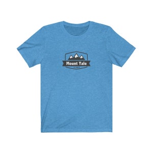 May include: A light blue t-shirt with a black and white graphic of a mountain range with the text "Mount Yale 14,198 ft" in a black banner.