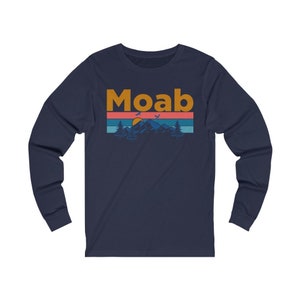 May include: Navy blue long-sleeve t-shirt with a retro-style graphic of a mountain range, sunset, and the word "Moab" in orange.