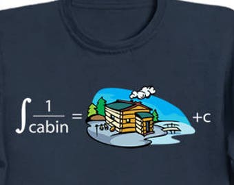 May include: A navy blue t-shirt with a white mathematical equation and a cartoon image of a cabin in the woods. The equation reads "∫ 1/cabin = +C".