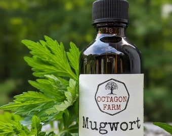 May include: A brown glass bottle with a black dropper lid and a white label. The label says "Octagon Farm Mugwort alcohol tincture 2 fl oz crafted in Fletcher, VT".