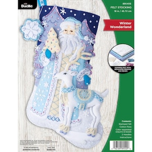 May include: A Bucilla Winter Wonderland felt stocking kit measuring 45.72 cm. The blue and white stocking features a Santa Claus figure, a white reindeer, and a small tree, all decorated with sequins and beads. Includes floss and needles.