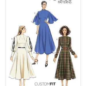May include: A sewing pattern for a dress with three different styles. The dress is shown in blue, white, and plaid. The pattern is called "CUSTOMFIT for A,B,C,D cup sizes" and the pattern number is "V9327".