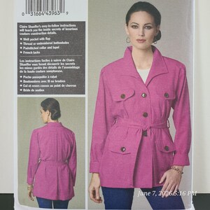 May include: A sewing pattern envelope featuring a magenta jacket with a collar, long sleeves, a tie waist, and four flap pockets. The front shows the jacket worn over a white top and blue pants, while the back view is shown in a smaller inset.