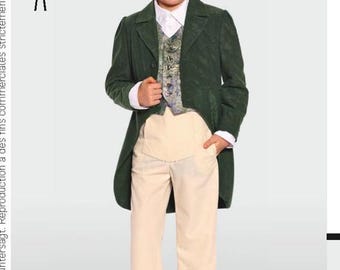 May include: A young boy wearing a green velvet suit with a white shirt, a patterned vest, and a black top hat. He is wearing beige pants and black shoes.