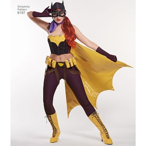 May include: A woman wearing a purple and black batgirl costume with a yellow cape and black boots. The costume includes a black corset with a bat symbol, a purple scarf, and a black belt with a bat symbol. The woman is wearing a black mask with a yellow bat symbol.