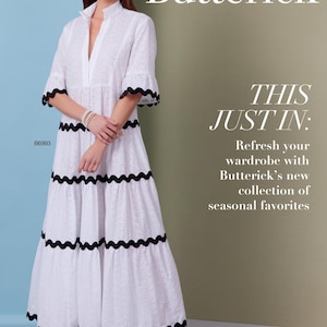 May include: A white eyelet dress with black scalloped trim, featured on a Butterick pattern cover. The dress has a tiered skirt and short sleeves. The text "THIS JUST IN" and "Refresh your wardrobe with Butterick's new collection of seasonal favorites" are also visible.