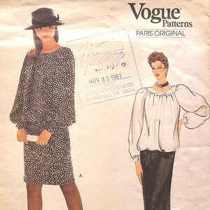 May include: Vintage Vogue Patterns Paris Original sewing pattern featuring two women wearing blouses. The pattern is dated November 25, 1983. The pattern is from Cupertino, CA.