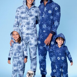 May include: A family of four and their dog wearing matching blue and white snowflake pajamas. The pajamas have a zipper closure and a hood. The dog is wearing a blue and white snowflake hooded onesie.