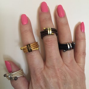 Stacked, unisex leather and metal rings. Comfortable and adjustable. Choose your color and size.