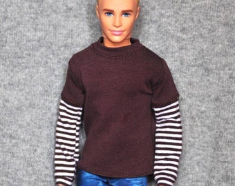 May include: A brown long-sleeved shirt with white and brown striped sleeves. The shirt has a mock neck.