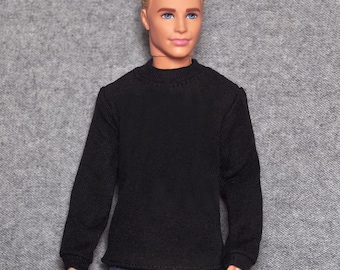 May include: A black mock neck shirt with long sleeves. The shirt is made of a soft, ribbed fabric.