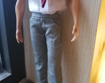 May include: A gray pair of pants with a white shirt and a red and black striped tie.