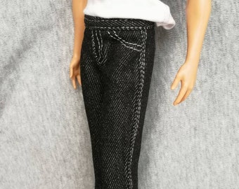 May include: Black denim jeans with white stitching. The jeans have a straight leg fit.