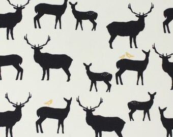 May include: A white fabric with a black silhouette pattern of various deer and a few small birds. The deer are in different poses, some with antlers and some without.