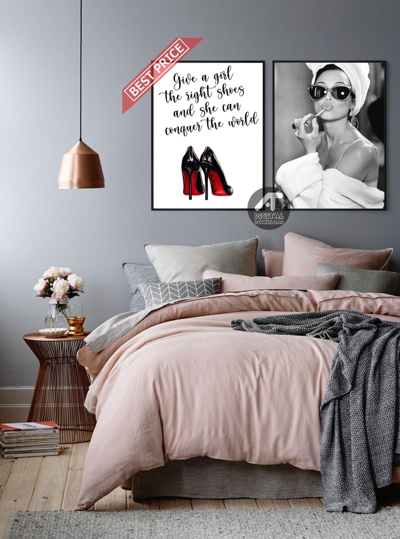 May include: Two printable wall art prints with a black and white photo of a woman wearing a white towel on her head and a pair of sunglasses, applying lipstick, and a quote about shoes and conquering the world.