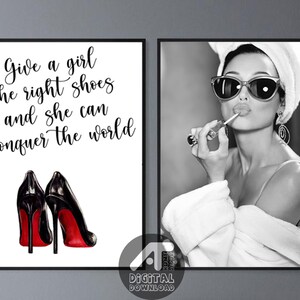 May include: A set of two black and white printable wall art prints. The first print features a pair of black high heels with red soles and the text "Give a girl the right shoes and she can conquer the world". The second print features a black and white photo of a woman wearing a white robe and sunglasses, applying lipstick.