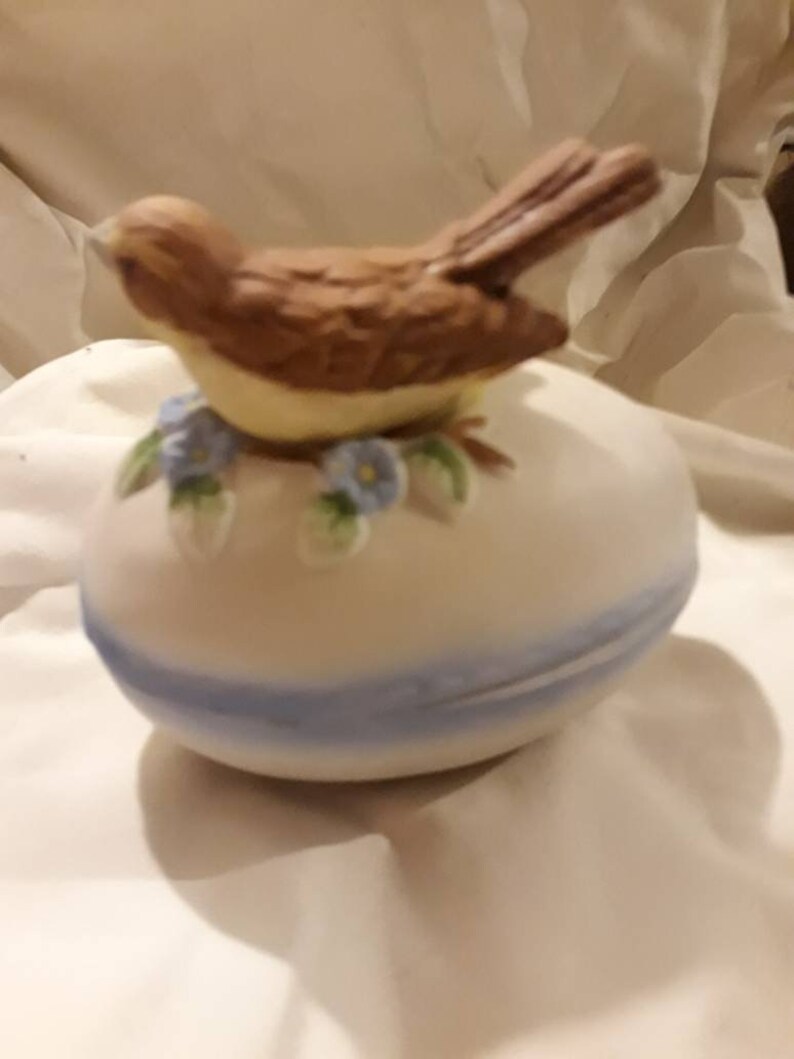 Vintage bisque bird on an egg trinket box
