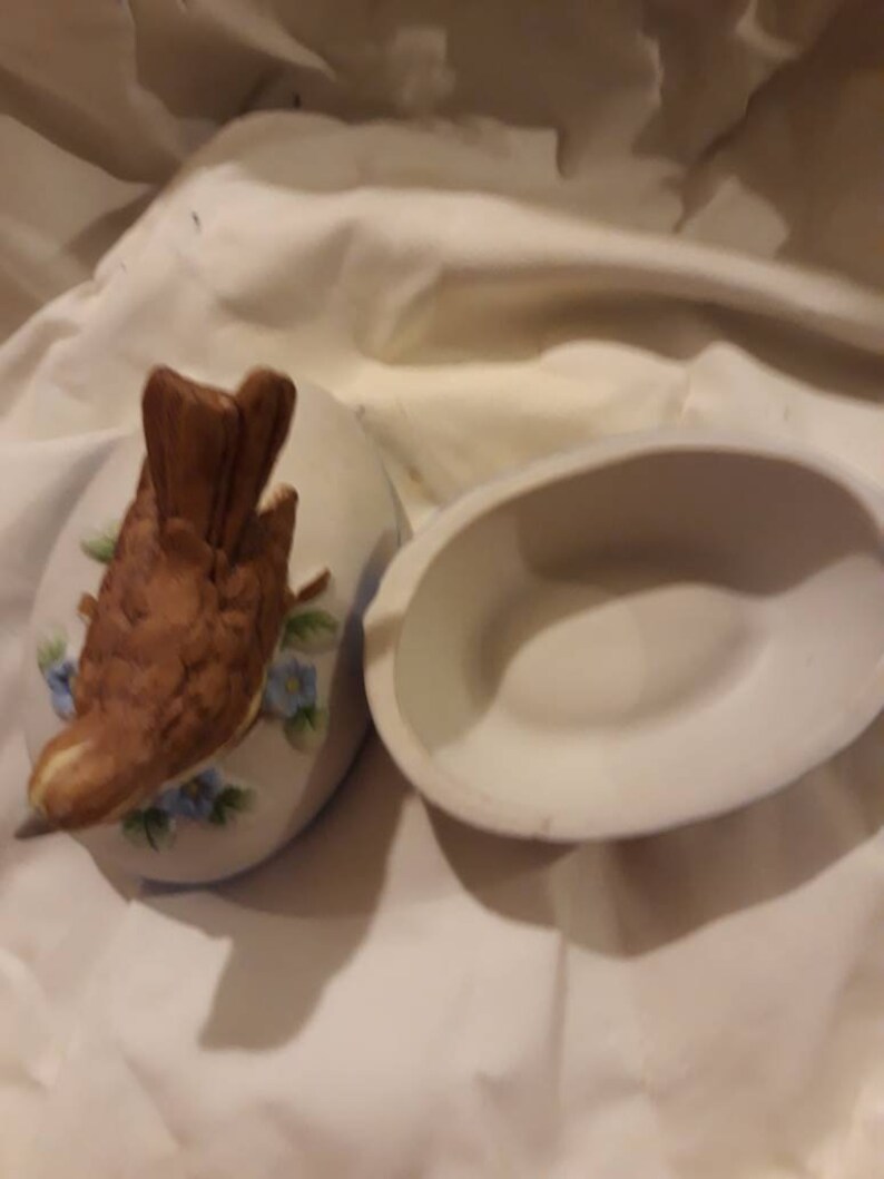 Vintage bisque bird on an egg trinket box