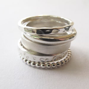 Sterling silver stacking ring set, five stacking rings with various textured finishes