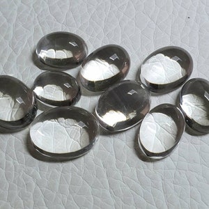 AAA Clear Quartz calibrated cabochon oval shape. Crystal Quartz 15x11MM to 21x16MM loose gemstone. Price for one.