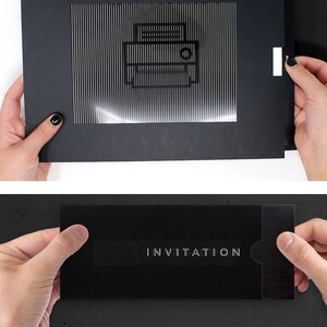 May include: A black rectangular card featuring a lenticular animation effect. The top section displays a printer icon, while the bottom section reveals the word INVITATION in white capital letters when the sliding mechanism is activated.