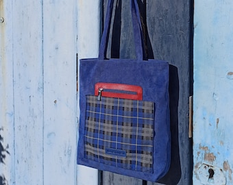 Blue corduroy shopper bag with pockets. Corduroy shopper bag with leather and blue tartan pockets. Blue tote bag.