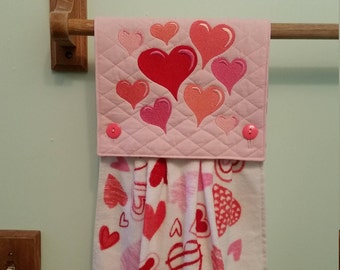 Floating hearts embroidered towel in pinks and red