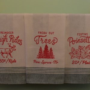 Christmas embroidered kitchen towels with green borders, Christmas kitchen, Christmas decor, sleigh rides, fresh-cut trees, poinsettias