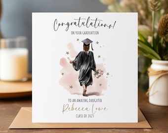 May include: A graduation card with a watercolor illustration of a person in a cap and gown walking away from the viewer. The card says "Congratulations! On your graduation" and "To an amazing daughter Rebecca Lowe Class of 2023".