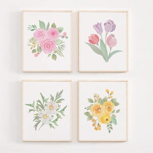 May include: Four framed watercolor paintings of floral bouquets. The top left painting features pink roses, the top right painting features purple tulips, the bottom left painting features white daisies, and the bottom right painting features yellow roses.