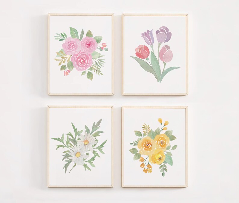 May include: Four framed watercolor paintings of floral bouquets. The top left painting features pink roses, the top right painting features purple tulips, the bottom left painting features white daisies, and the bottom right painting features yellow roses.