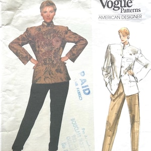 May include: Vogue Patterns American Designer fashion sewing pattern. The image shows a woman wearing a floral print jacket and black trousers. A second illustration shows a white jacket and tan trousers. The Vogue logo is visible.