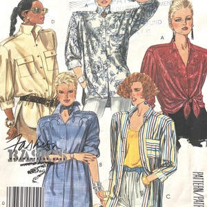 May include: A sewing pattern envelope titled Easy McCall's 5396 featuring illustrations of five different shirt styles. The designs include a beige utility shirt, a blue floral print shirt, a red button-down, a blue denim tunic, and a striped shirt.