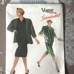 May include: Vogue Patterns Individualist sewing pattern. The package features illustrations of two women wearing a green suit and dress. The pattern number is 1737.