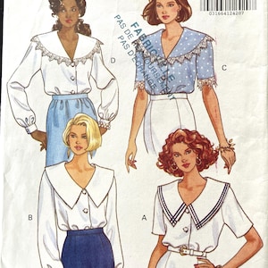 May include: A Butterick Fast & Easy sewing pattern envelope, number 5926, for sizes 12-14-16. The front displays four illustrations of blouses with large collars, button-front closures, and varying sleeve lengths, labeled A, B, C, and D.
