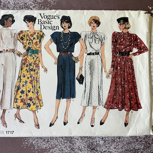 May include: A sewing pattern for four different dresses. The pattern is from Vogue's Basic Design and the pattern number is 1717. The dresses are all different colours and styles. One dress is white, one is yellow with a floral print, one is blue, and one is red with a floral print.