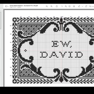 May include: A digital cross stitch pattern displayed on a screen, featuring a black and white grid design with an ornate decorative border surrounding the text EW, DAVID. The pattern includes numbered grid lines for precise stitching guidance.