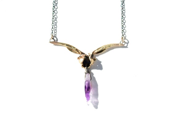 Handmade Alas Anguis Necklace in Brass and Amethyst | cast snake bone