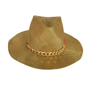 May include: A gold straw hat with a gold chain trim. The hat has a wide brim and a tall crown.