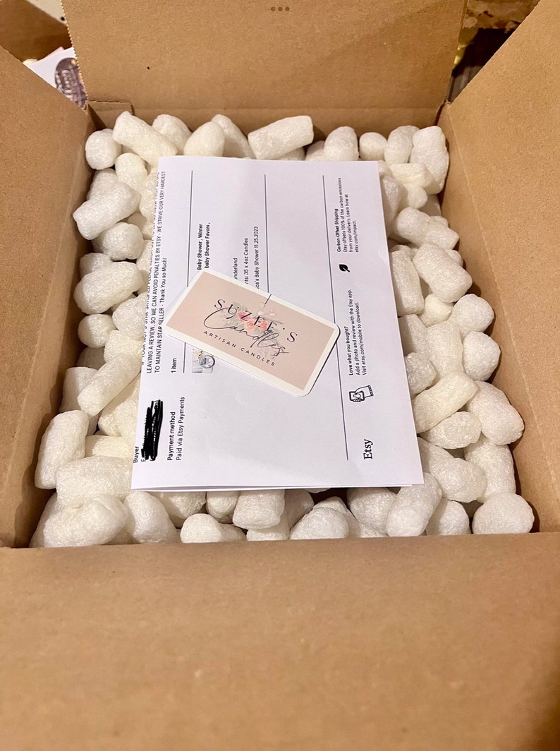 a box filled with lots of white rocks