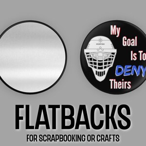May include: Two round flatback buttons. One button is black with a white hockey goalie mask and the text "My Goal Is To DENY Theirs". The other button is silver with a black border.