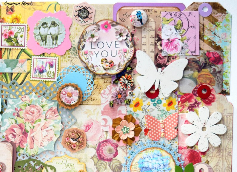 May include: A collage of paper crafts with a floral theme. The collage includes butterflies, flowers, hearts, and other decorative elements. The words "Love You" are featured in a circle with a floral design.