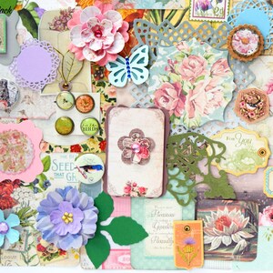 May include: A collection of paper craft embellishments featuring floral designs, butterflies, birds, and the text "The Be Seed That Gr", "Birds", and "For You".