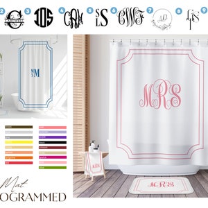 May include: A white shower curtain with a pink monogram "MRS" in a decorative font. The shower curtain has a white border with a scalloped edge. The shower curtain is hanging in a bathroom with a white tile floor and a white bathtub.