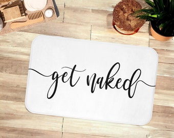 Alfombra de baño blanca con texto "Get Naked", divertida y original.