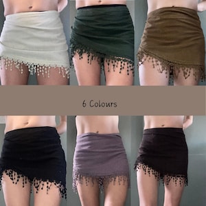 May include: Six mini skirts in various colors: light gray, dark green, olive green, black, purple, and dark brown. Each skirt has a fringed hemline. The text "6 Colours" is displayed in the center of the image.