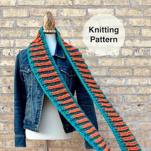 May include: A teal and orange striped scarf with a tassel on the end. The scarf is draped over a mannequin against a brick wall. "Knitting Pattern" is written in a circle above the scarf.