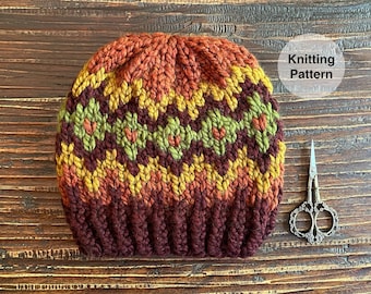 May include: Knitting pattern for a brown, orange, and green striped hat with a "Knitting Pattern" label.